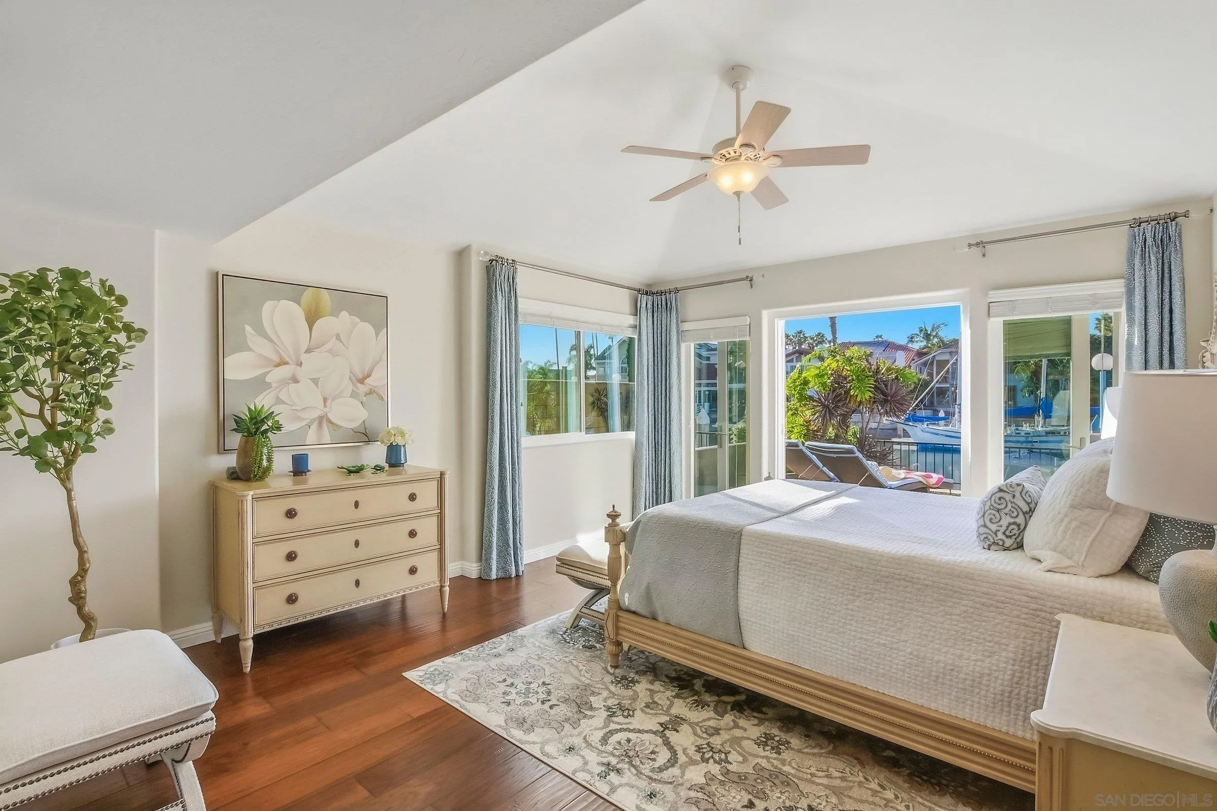 52 Spinnaker Way Coronado, CA 92118 - Photo 17 of 45 a bedroom with a bed and large window with wooden floor