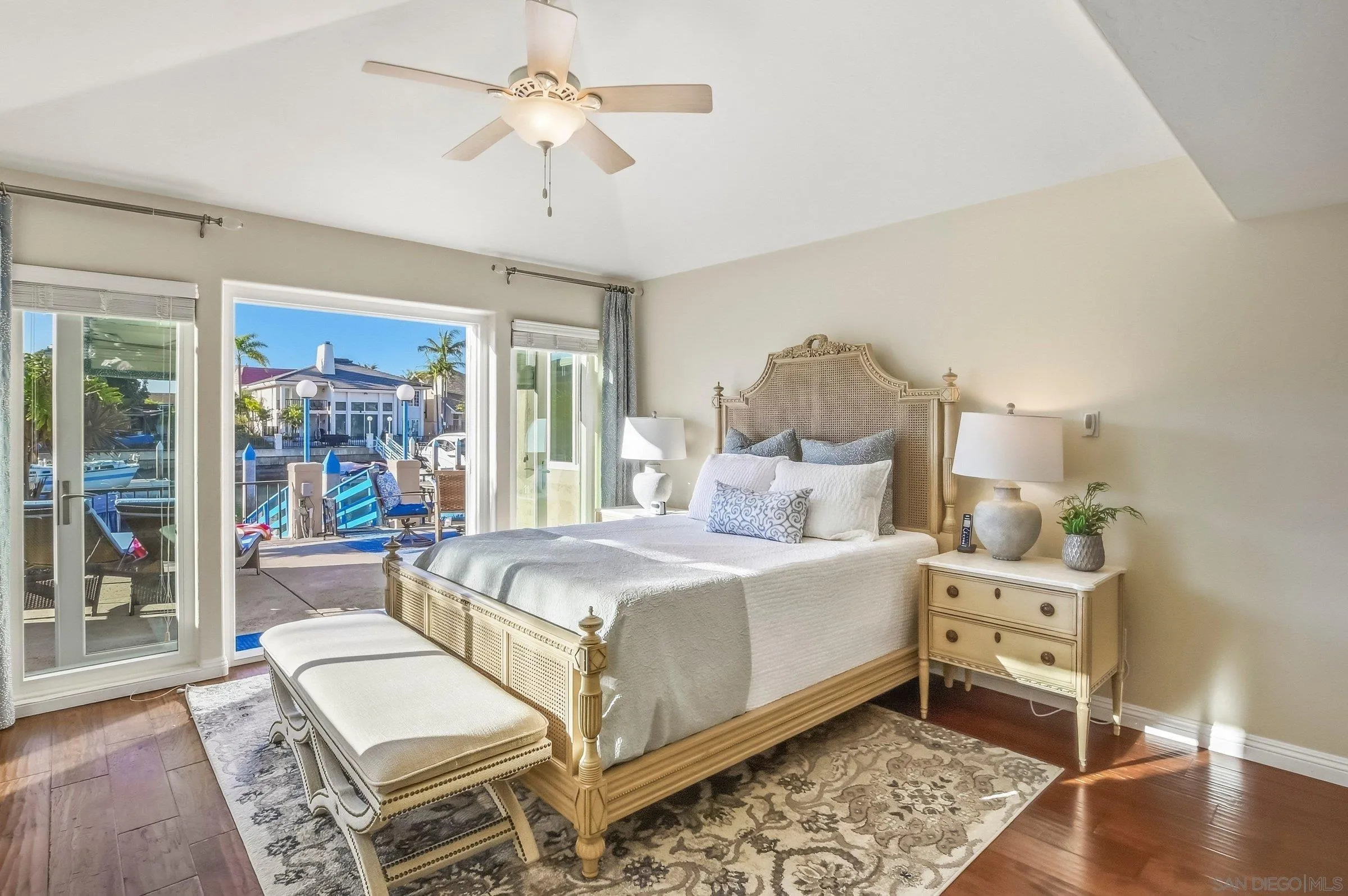52 Spinnaker Way Coronado, CA 92118 - Photo 18 of 45 a bedroom with a bed and wooden floor