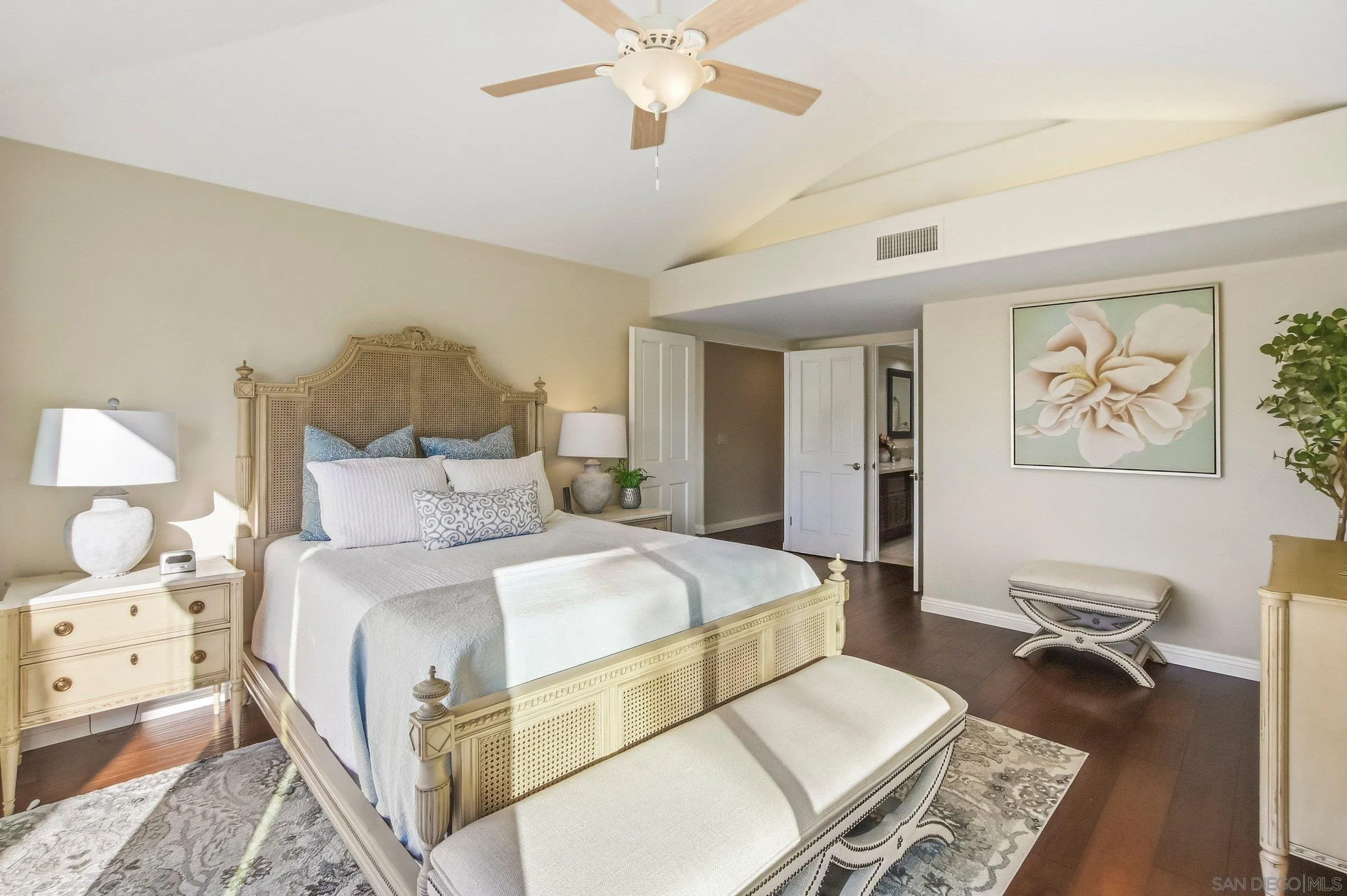 52 Spinnaker Way Coronado, CA 92118 - Photo 19 of 45 a bedroom with a bed and a chandelier
