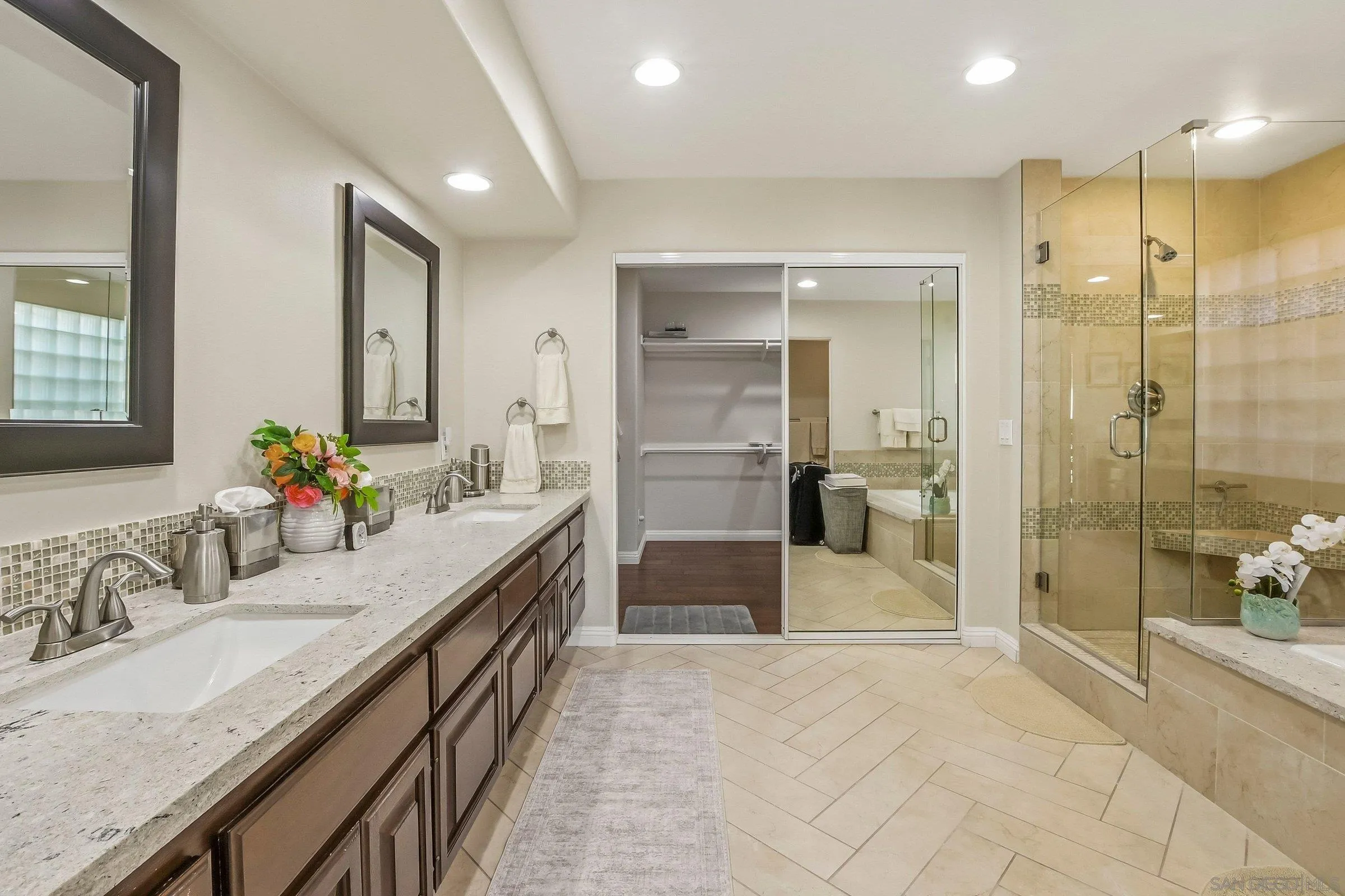 52 Spinnaker Way Coronado, CA 92118 - Photo 21 of 45 a large bathroom with a granite countertop sink mirror and shower
