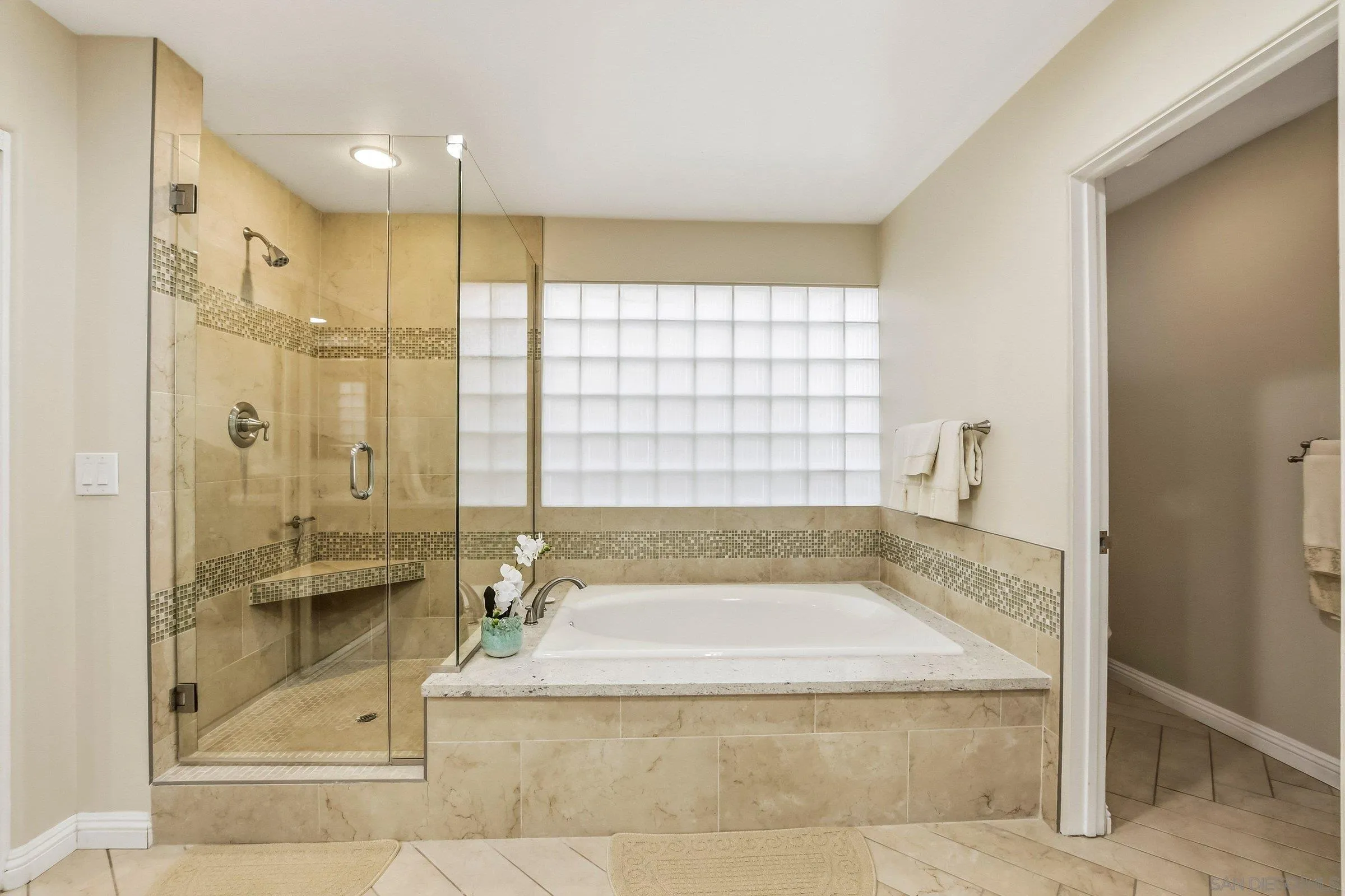 52 Spinnaker Way Coronado, CA 92118 - Photo 22 of 45 a bathroom with a granite countertop tub sink shower and mirror