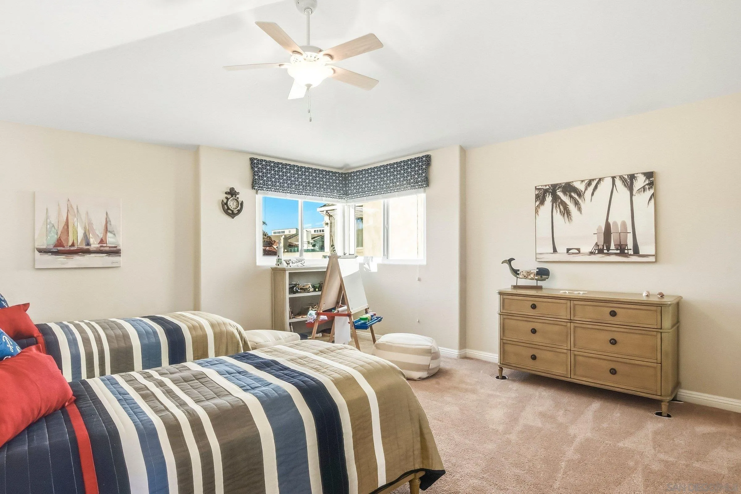 52 Spinnaker Way Coronado, CA 92118 - Photo 24 of 45 a bed room with bed and a chandelier