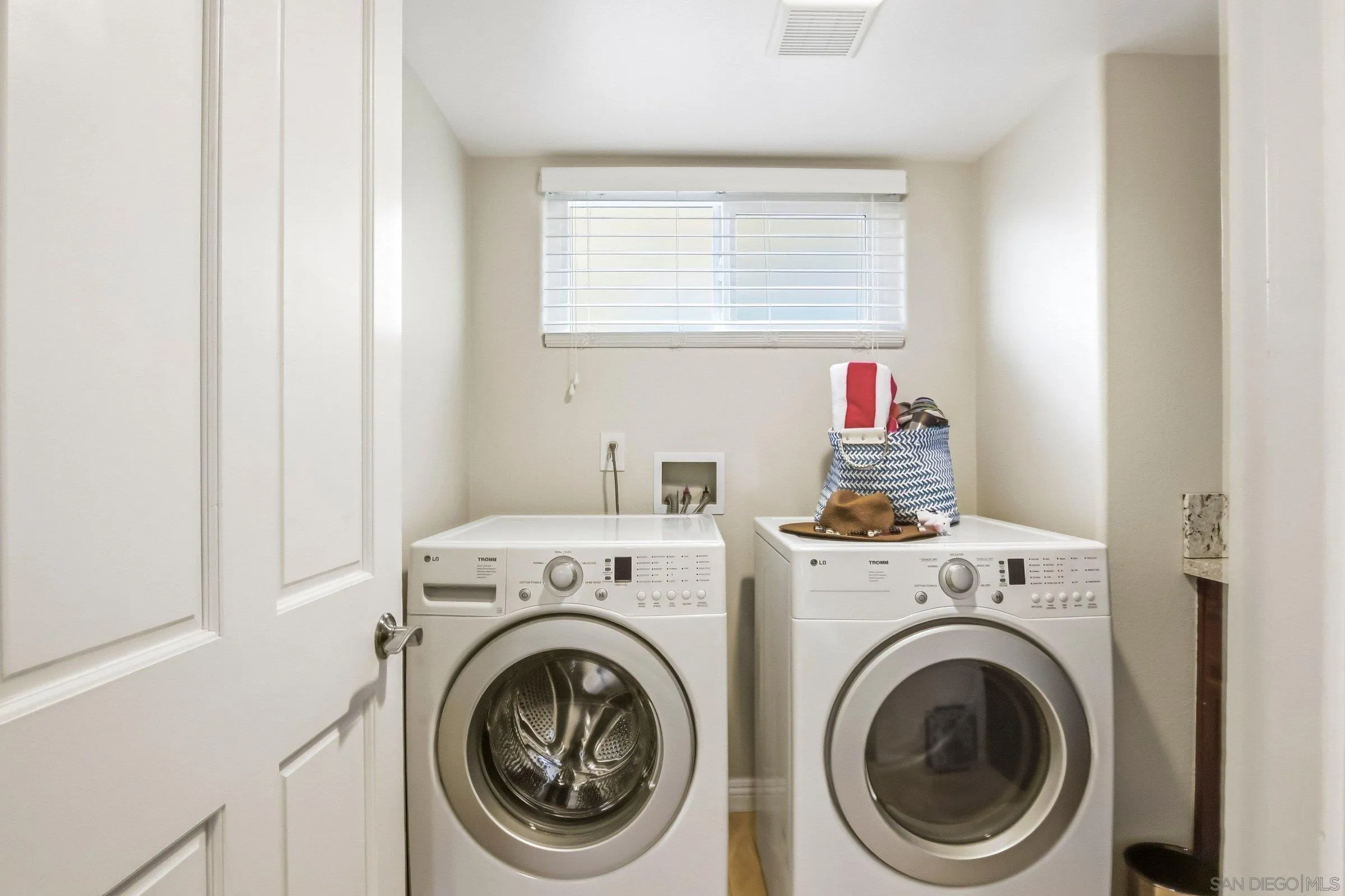52 Spinnaker Way Coronado, CA 92118 - Photo 29 of 45 a utility room with dryer and washer