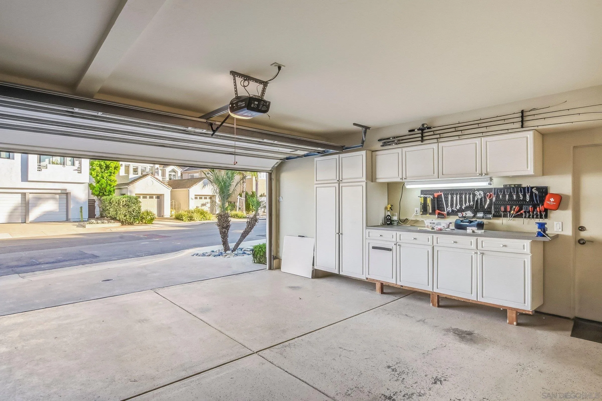 52 Spinnaker Way Coronado, CA 92118 - Photo 30 of 45 a open kitchen with white cabinets and refrigerator