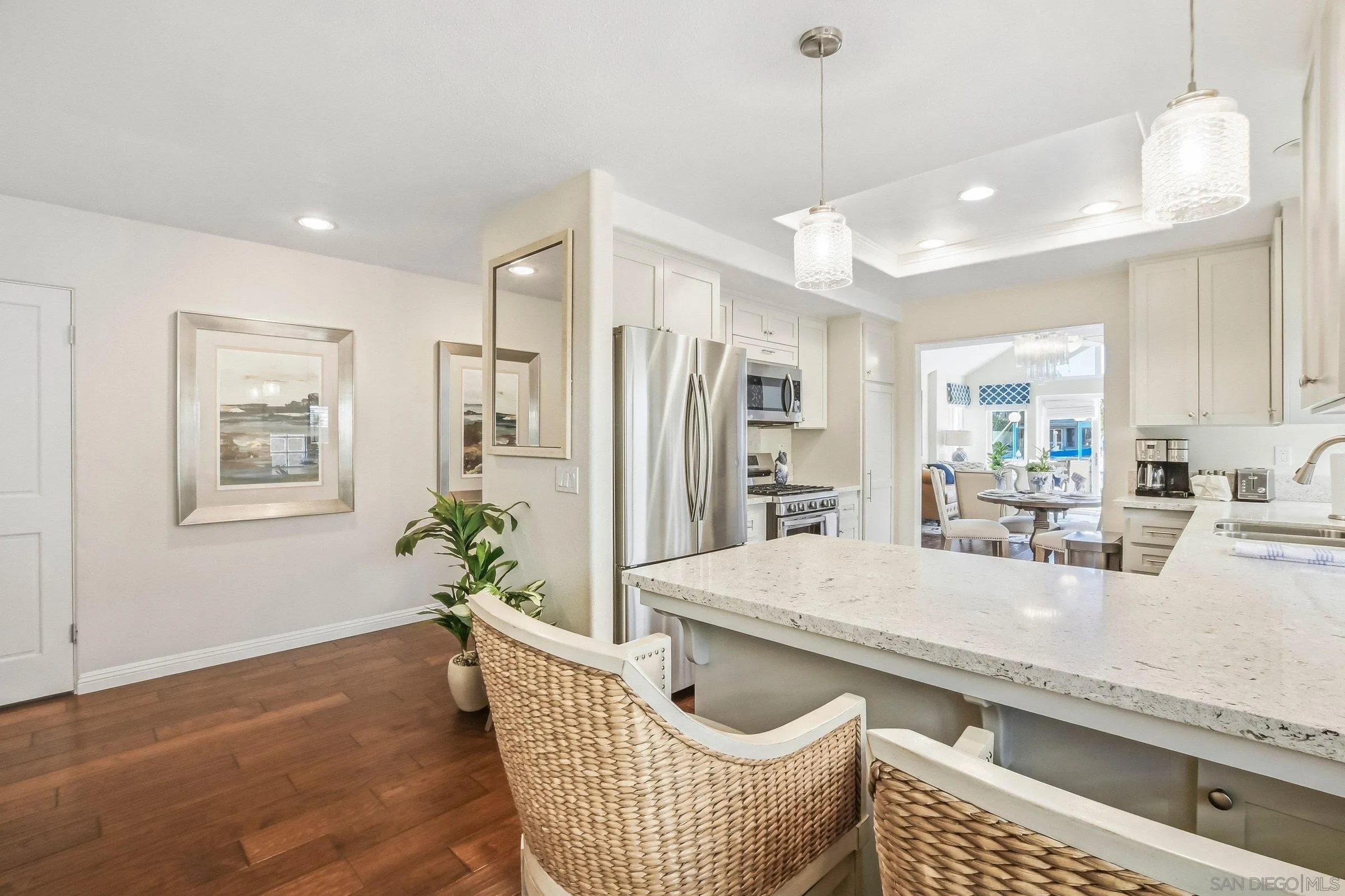 52 Spinnaker Way Coronado, CA 92118 - Photo 5 of 45 a living room with furniture and a wooden floor