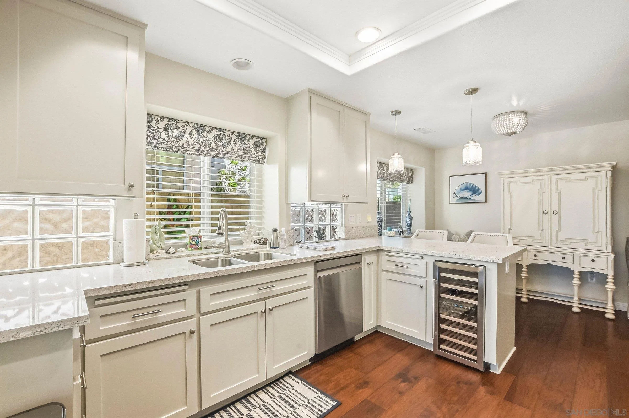 52 Spinnaker Way Coronado, CA 92118 - Photo 8 of 45 a kitchen with a sink stove and cabinets