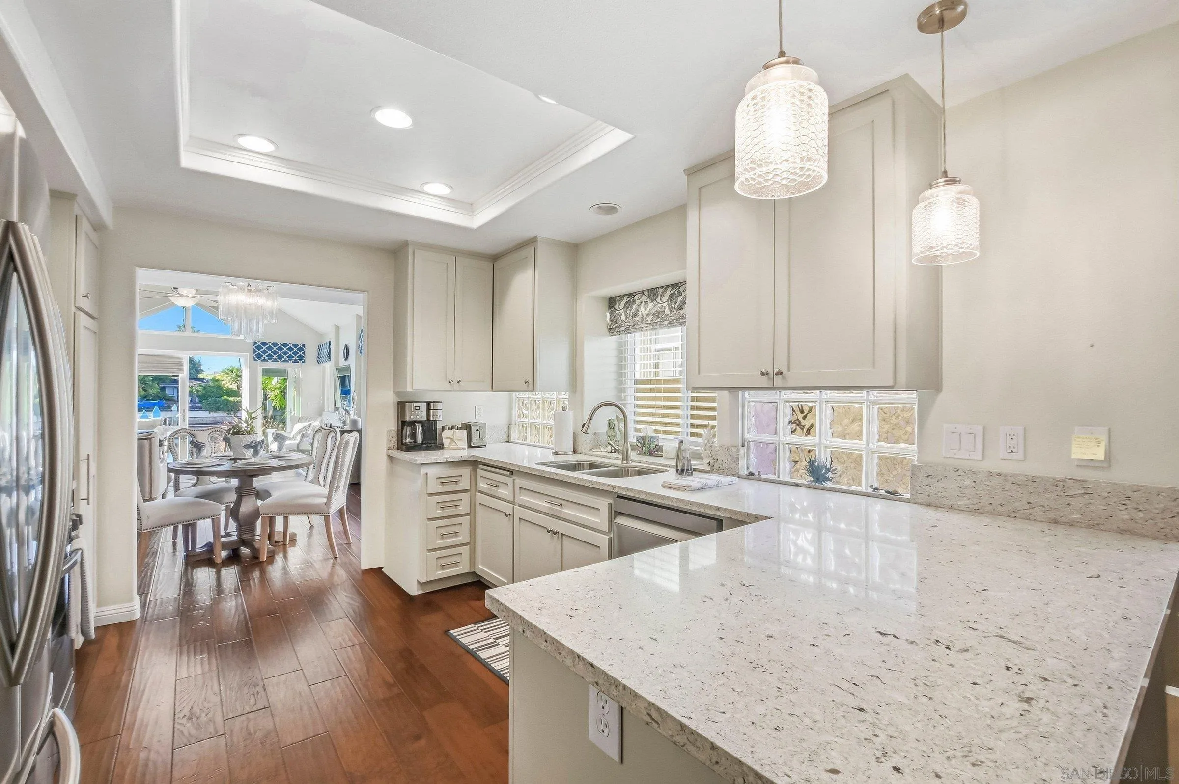 52 Spinnaker Way Coronado, CA 92118 - Photo 9 of 45 a large kitchen with lots of counter space and stainless steel appliances