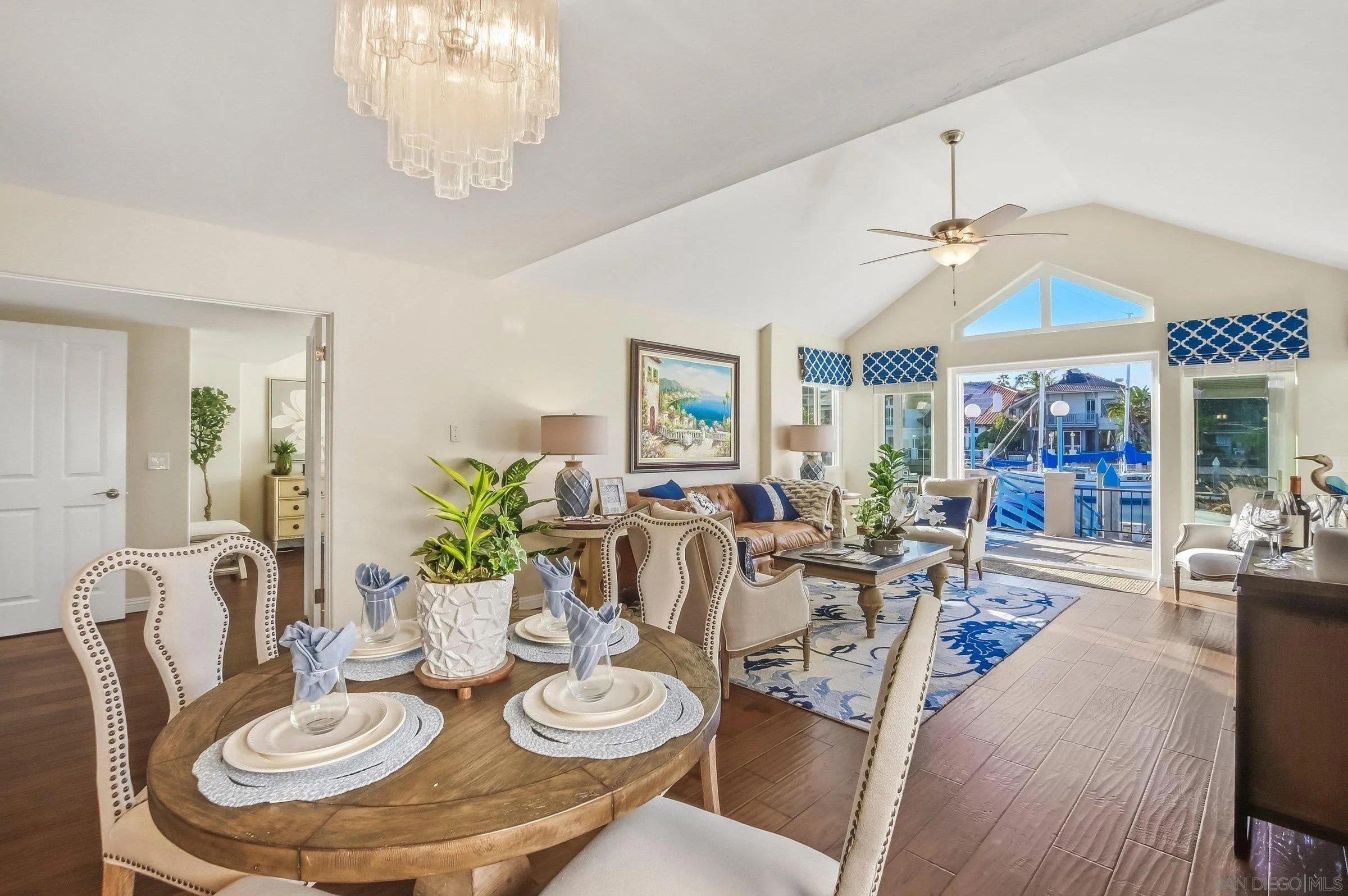52 Spinnaker Way Coronado, CA 92118 - Photo 10 of 45 a dining room with furniture a chandelier and window