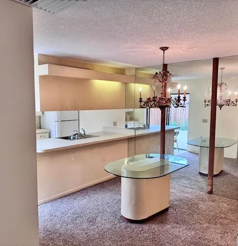 a room with a table and chairs