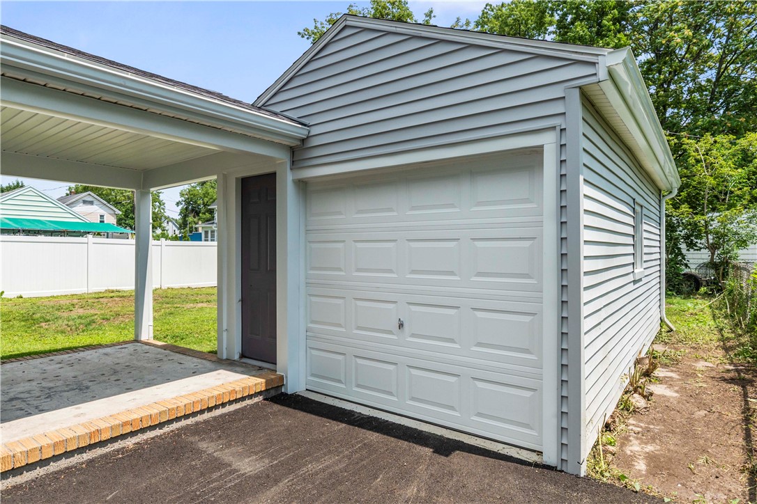 358 Glide Street Rochester, NY 14611 - Photo 23 of 30 Detached garage adjacent with pedestrian door under covered patio
