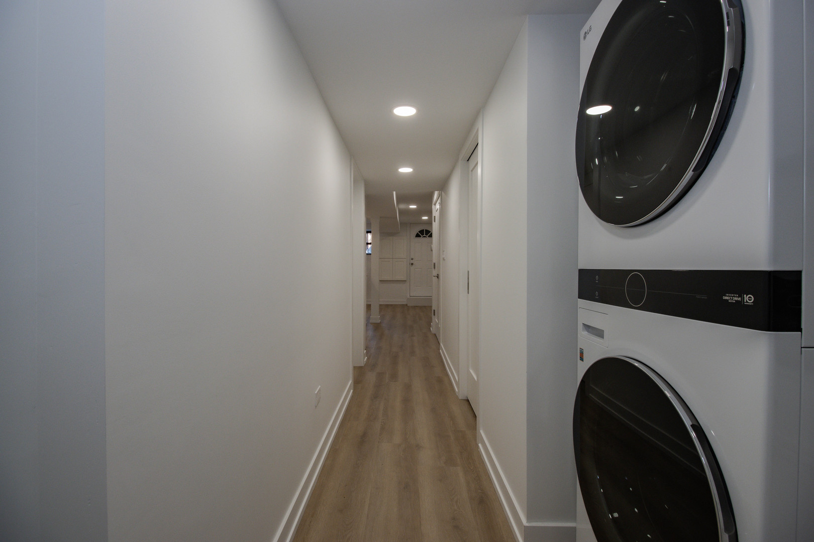 1139 North Winchester Avenue, Unit G Chicago, IL 60622 - Photo 17 of 22 a view of a hallway with washer and dryer