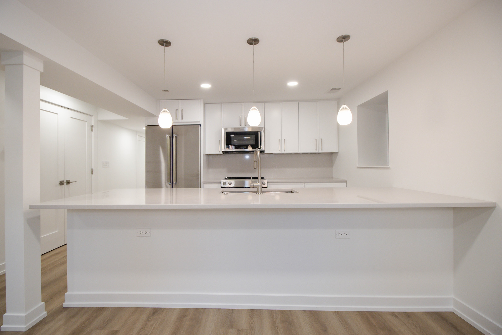 1139 North Winchester Avenue, Unit G Chicago, IL 60622 - Photo 6 of 22 a view of kitchen with wooden floor