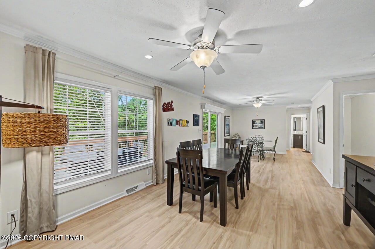 2016 Locust Ridge Road Pocono Lake, PA 18347 - Photo 27 of 82 a view of a dining room with furniture and wooden floor