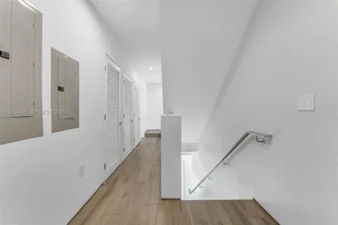 a view of a hallway with staircase