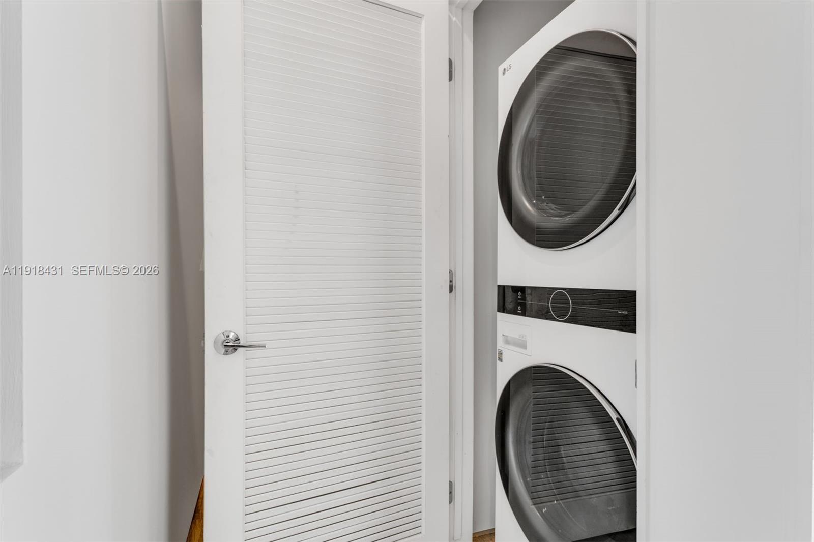 1525 Bay Road, Unit 1525 Miami Beach, FL 33139 - Photo 25 of 37 a close view of a utility room with dryer and washer