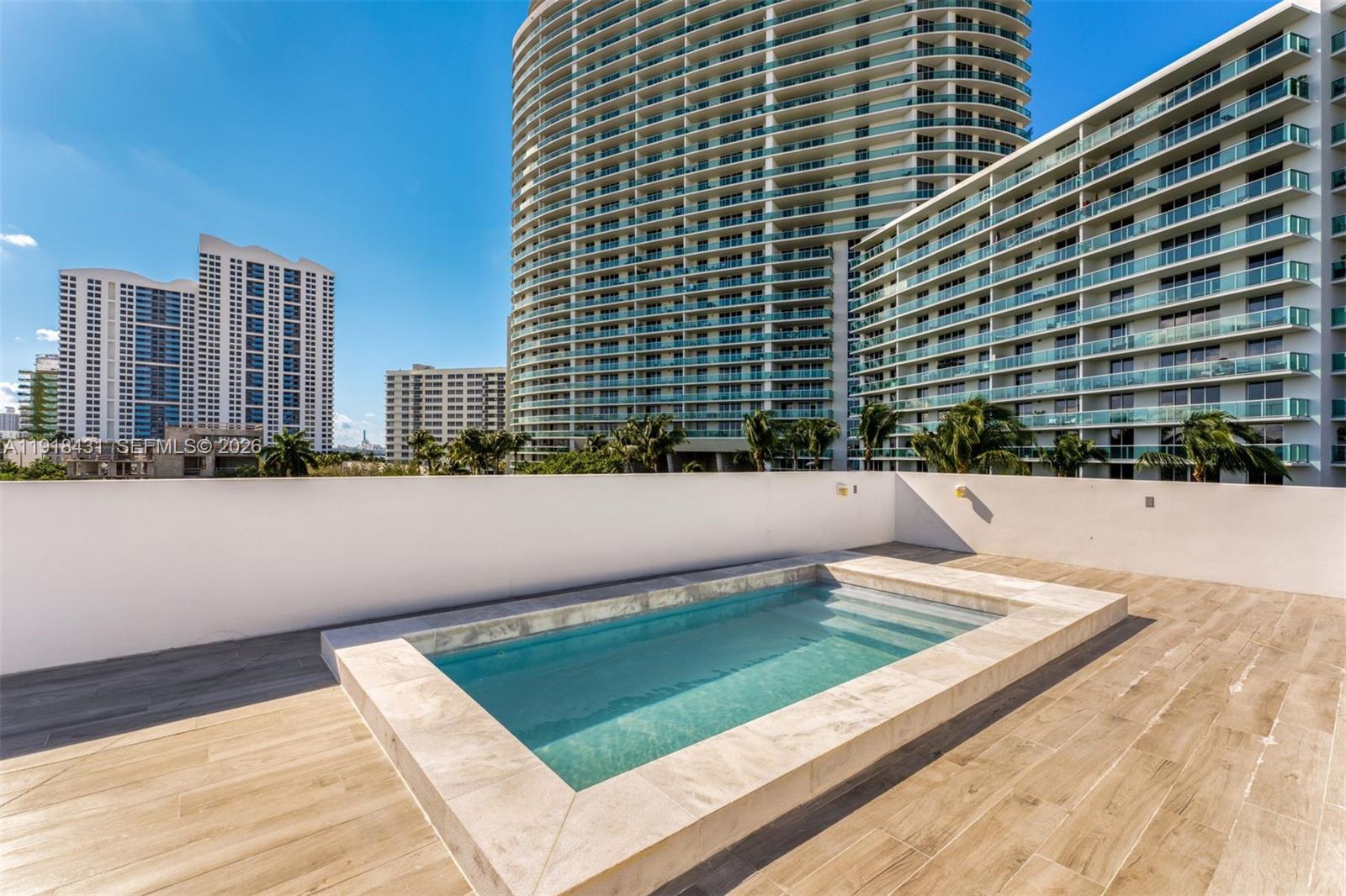 1525 Bay Road, Unit 1525 Miami Beach, FL 33139 - Photo 27 of 37 a view of swimming pool with a yard