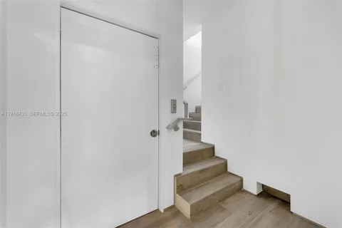 a view of entryway with wooden floor