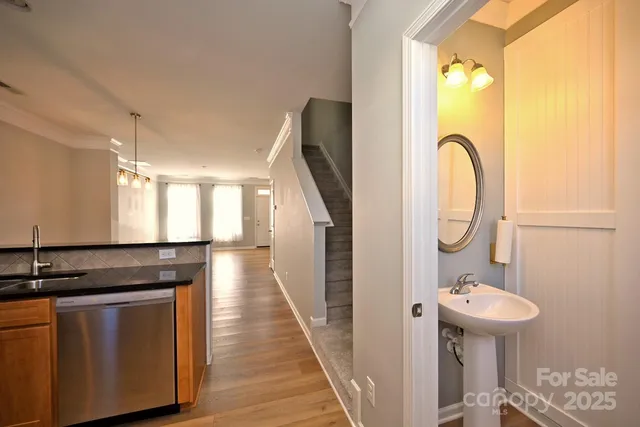 a kitchen with kitchen island a sink and a stove