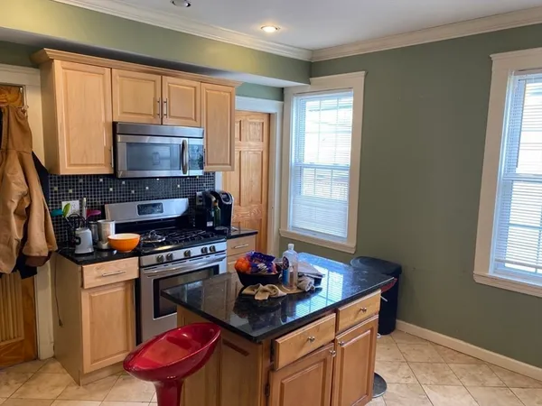 a kitchen with stainless steel appliances a stove a sink dishwasher and a microwave