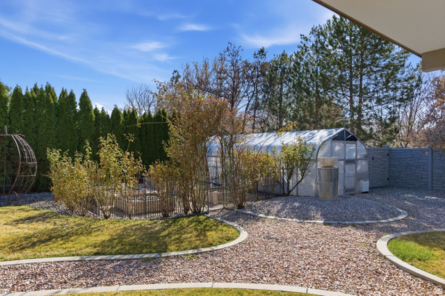 145 Carnesecca Court Mapleton, UT 84664 - Photo 82 of 109 Fenced yard featuring a greenhouse and an outbuilding