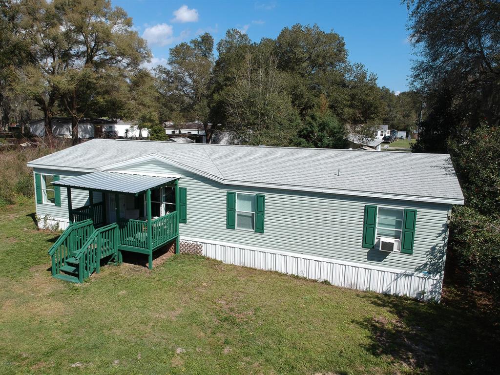 16761 Southeast 102nd Ave Road Summerfield, FL 34491 - Photo 1 of 1 front view of a house with a yard