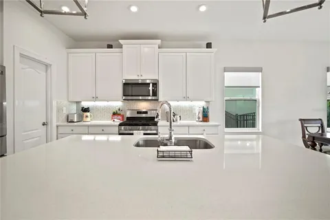 a living room with furniture fireplace and a flat screen tv