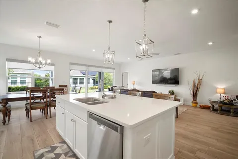 a bedroom with a bed a television and a window