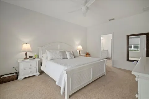 a view of a porch with chairs and backyard