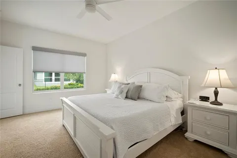a view of a patio with a table and chairs under an umbrella