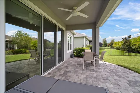 a view of a swimming pool with a yard