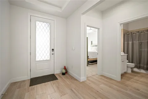 a kitchen with a stove and a white cabinets