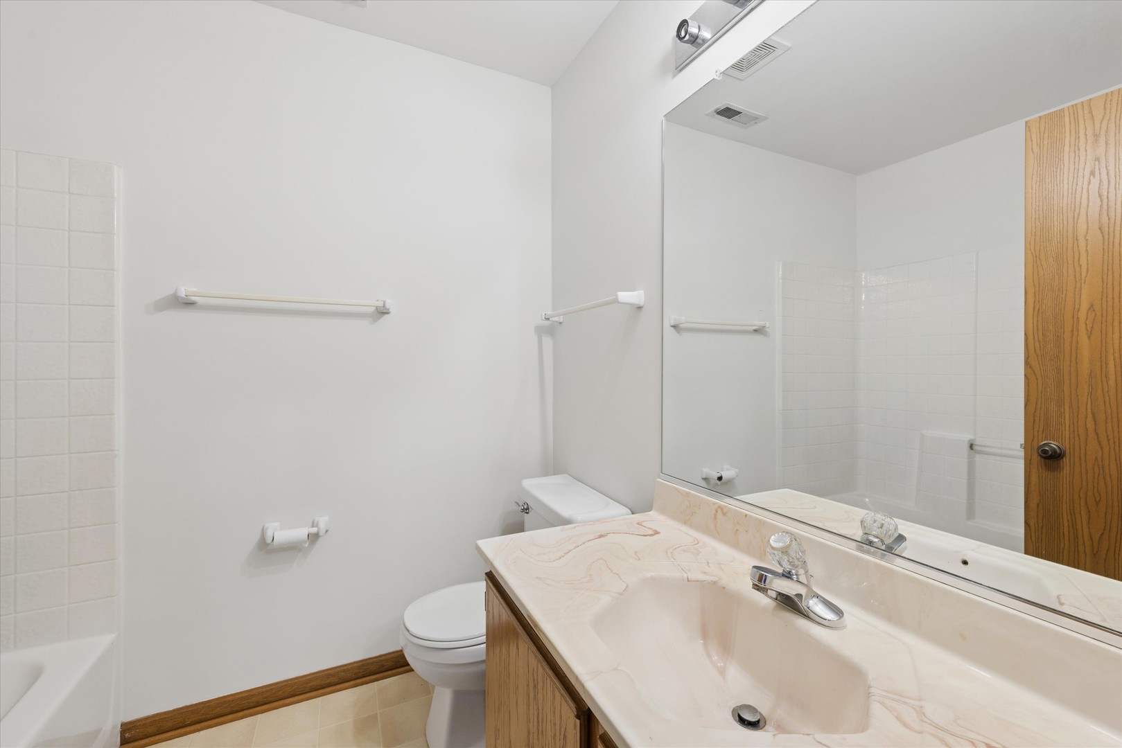 3 Dewalt Court Elmhurst, IL 60126 - Photo 12 of 17 a bathroom with a sink and a toilet