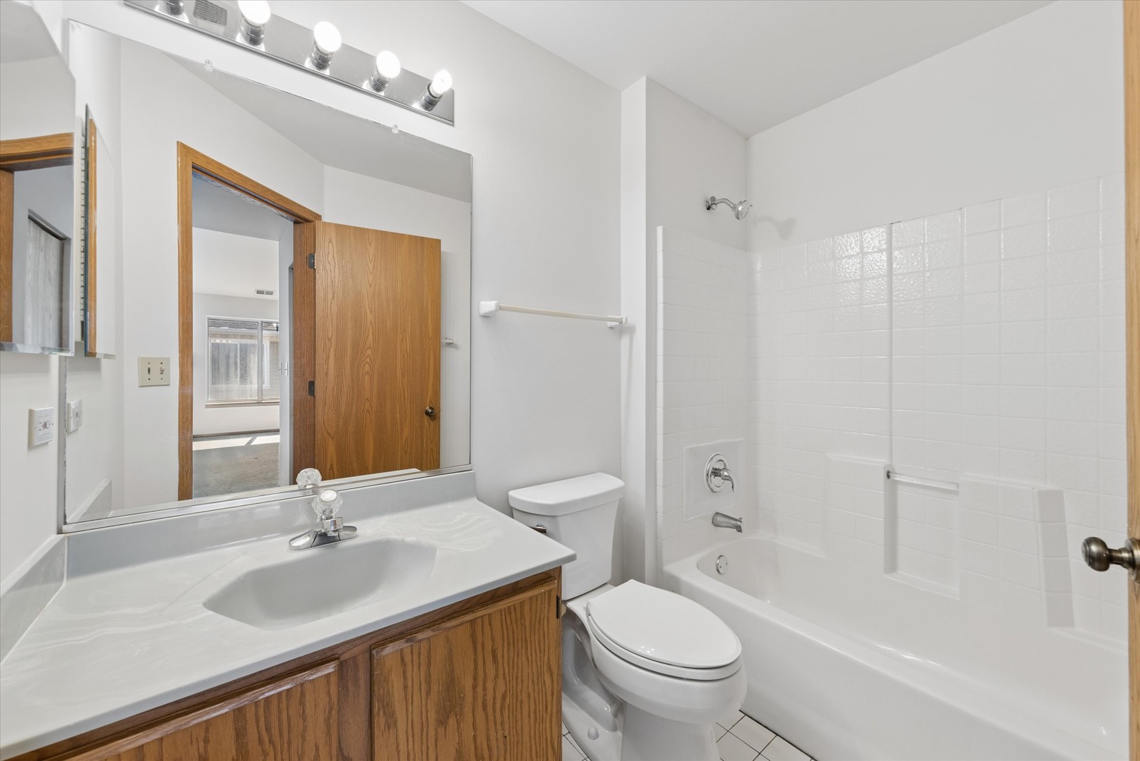 3 Dewalt Court Elmhurst, IL 60126 - Photo 13 of 17 a bathroom with a sink toilet tub and shower