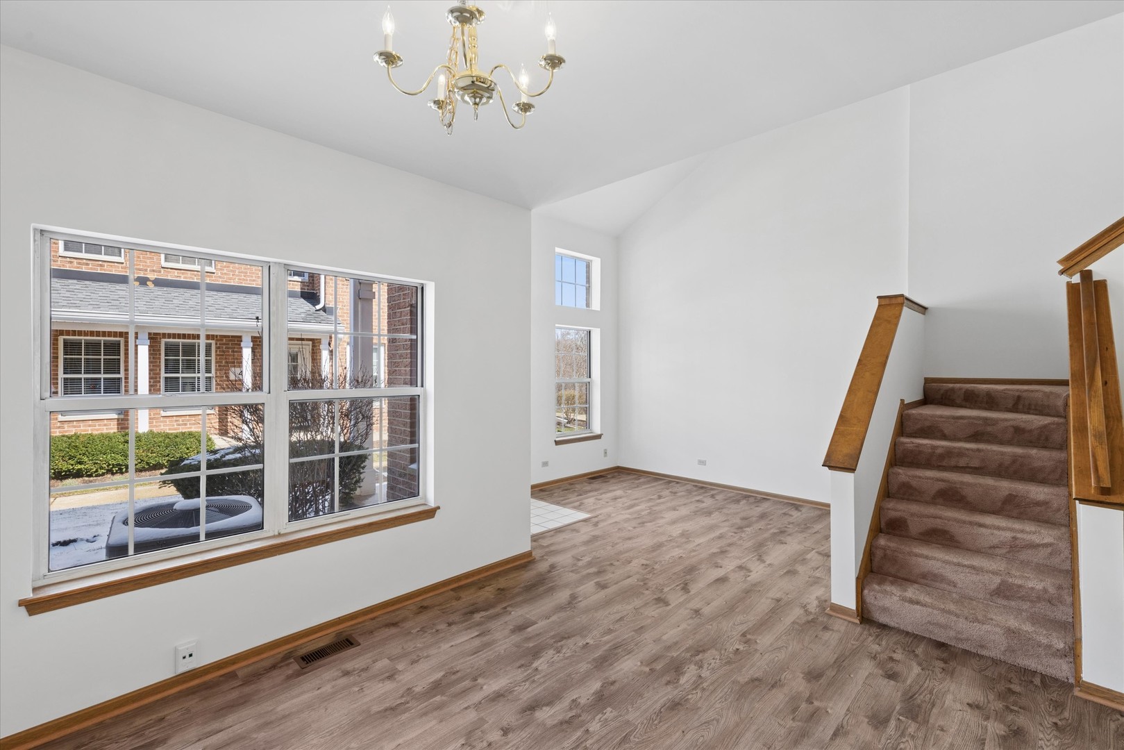 3 Dewalt Court Elmhurst, IL 60126 - Photo 5 of 17 wooden floor in an empty room with a window