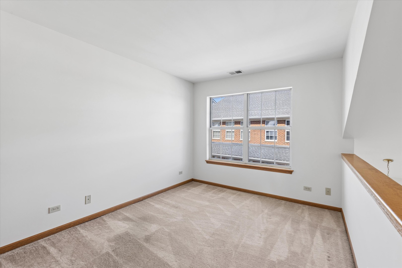 3 Dewalt Court Elmhurst, IL 60126 - Photo 7 of 17 an empty room with a window