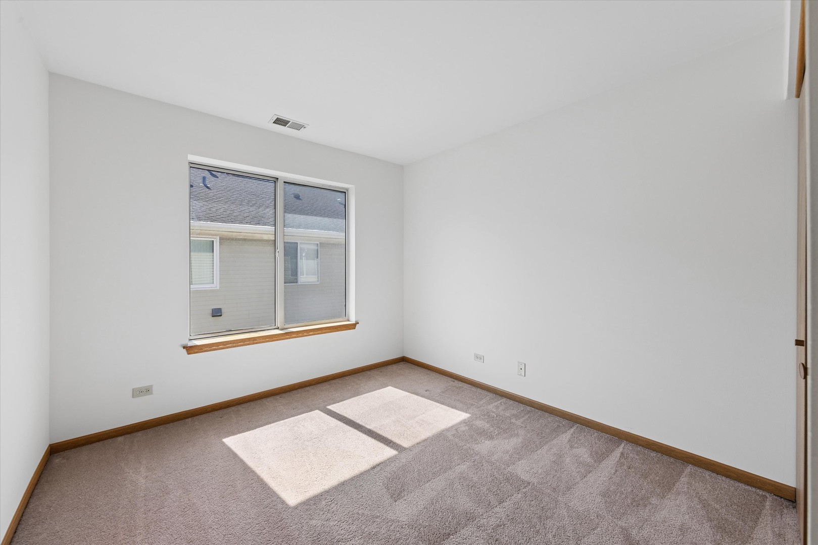 3 Dewalt Court Elmhurst, IL 60126 - Photo 8 of 17 an empty room with windows