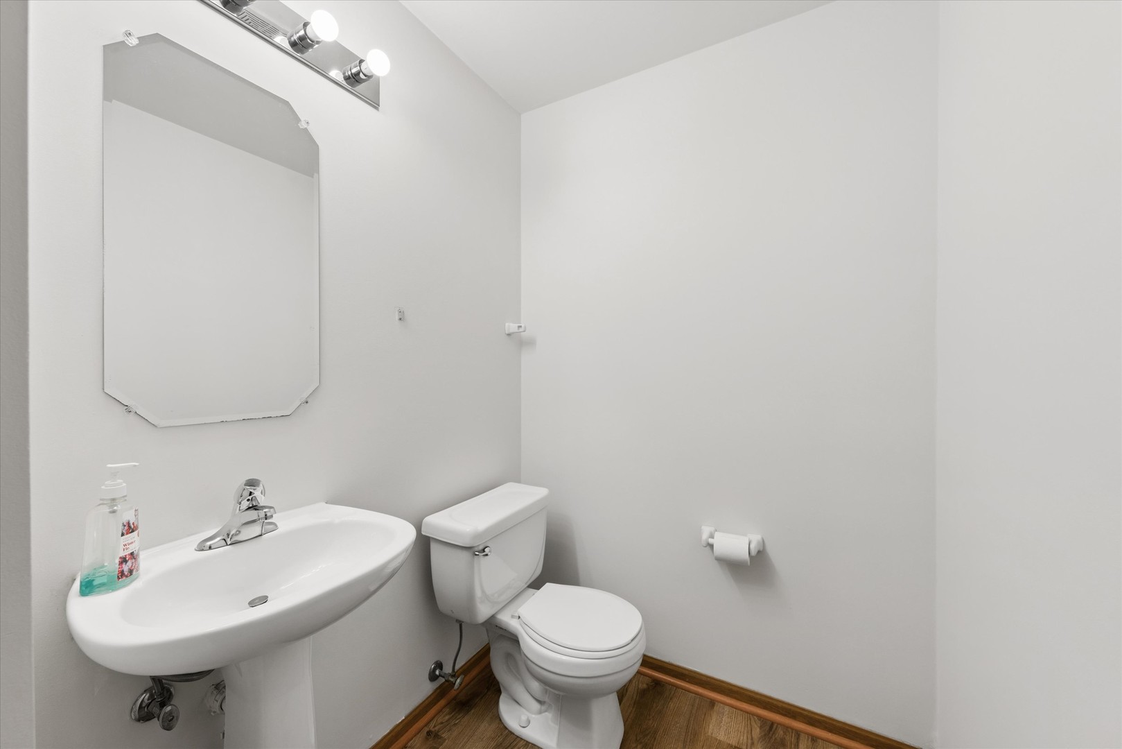 3 Dewalt Court Elmhurst, IL 60126 - Photo 10 of 17 a bathroom with a sink a toilet and mirror