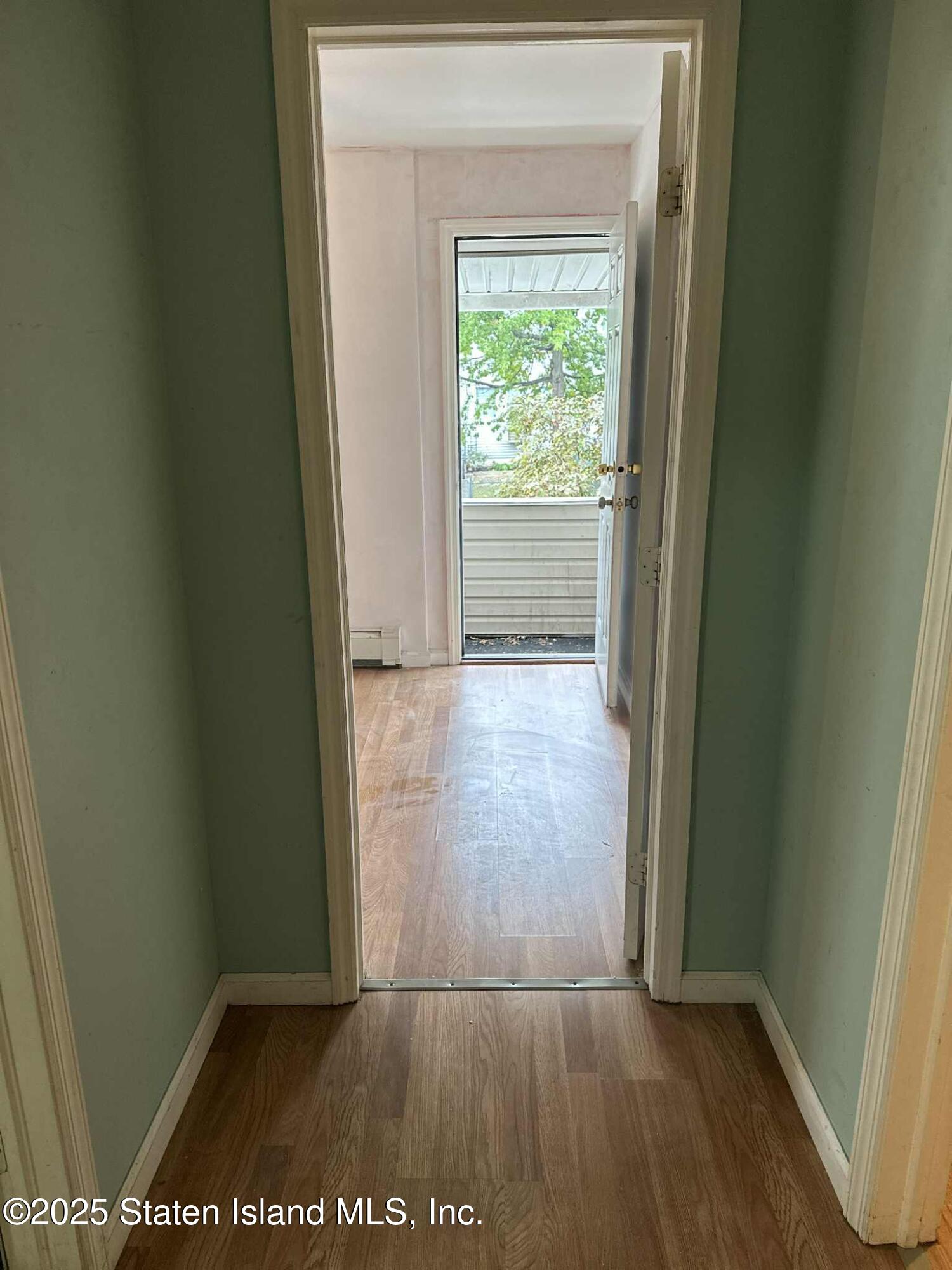 267 Gordon Street Staten Island, NY 10304 - Photo 17 of 37 an empty room with wooden floor and closet