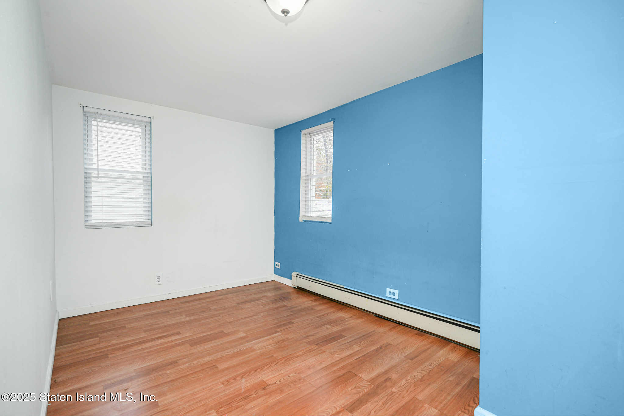 267 Gordon Street Staten Island, NY 10304 - Photo 21 of 37 a view of empty room with wooden floor