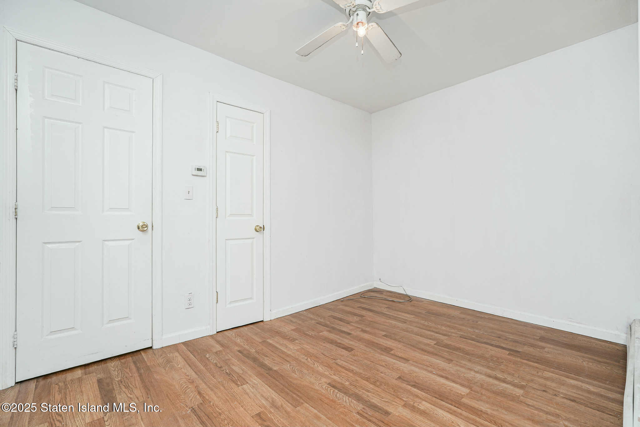 267 Gordon Street Staten Island, NY 10304 - Photo 23 of 37 wooden floor in an empty room
