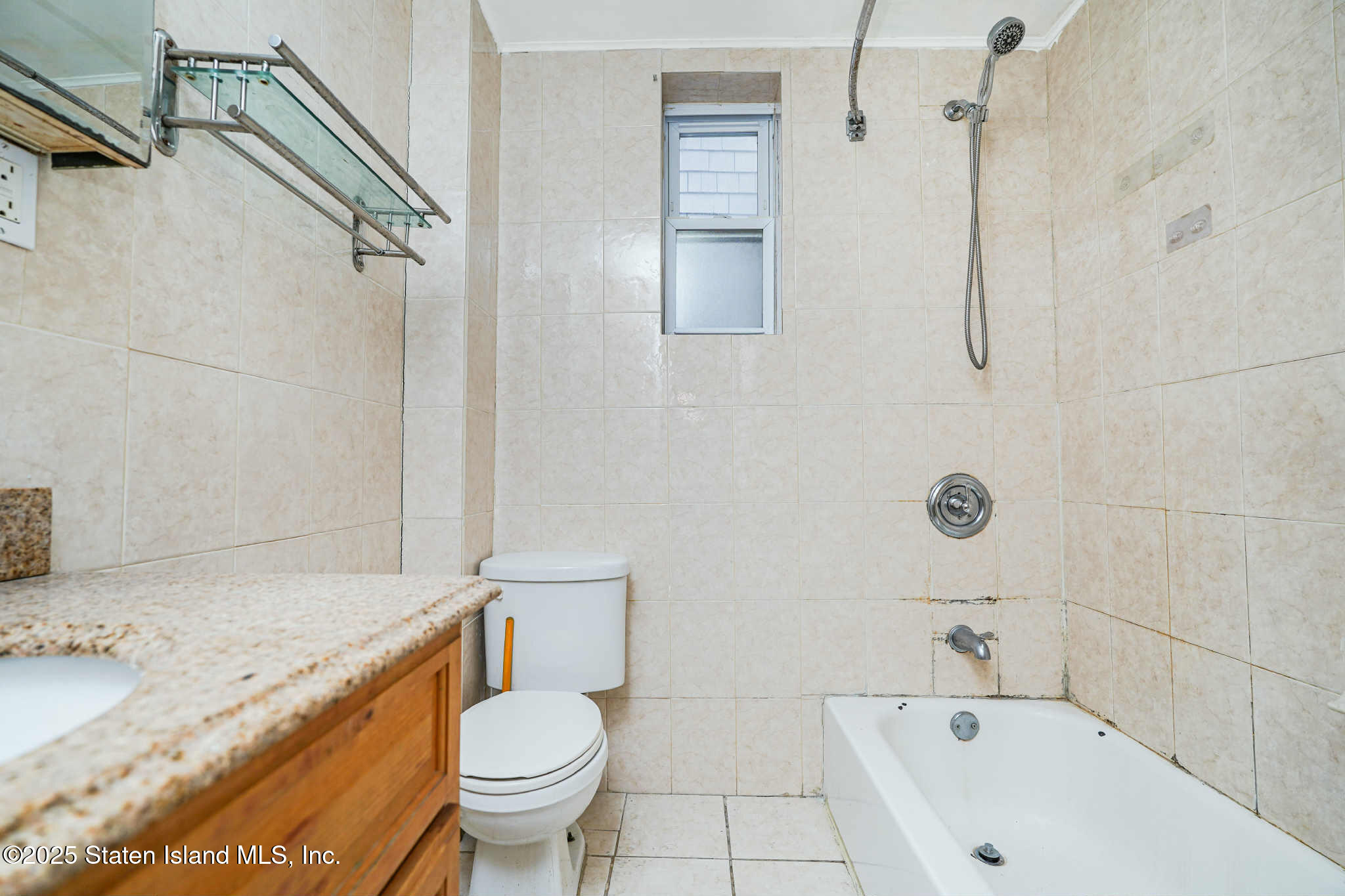 267 Gordon Street Staten Island, NY 10304 - Photo 25 of 37 a bathroom with a sink toilet and shower