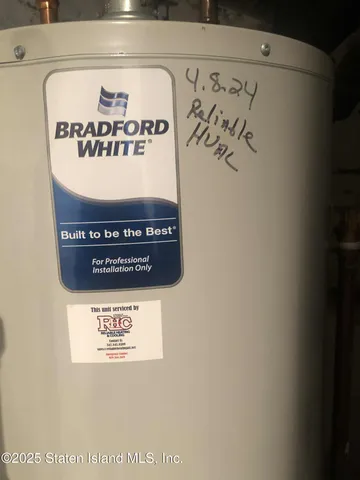 a view of a house with a yard and garage