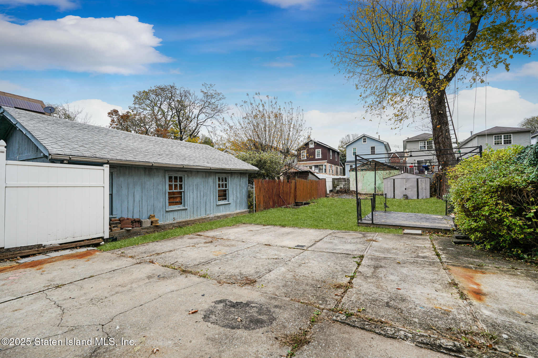 267 Gordon Street Staten Island, NY 10304 - Photo 33 of 37 a view of a house with a yard and garage