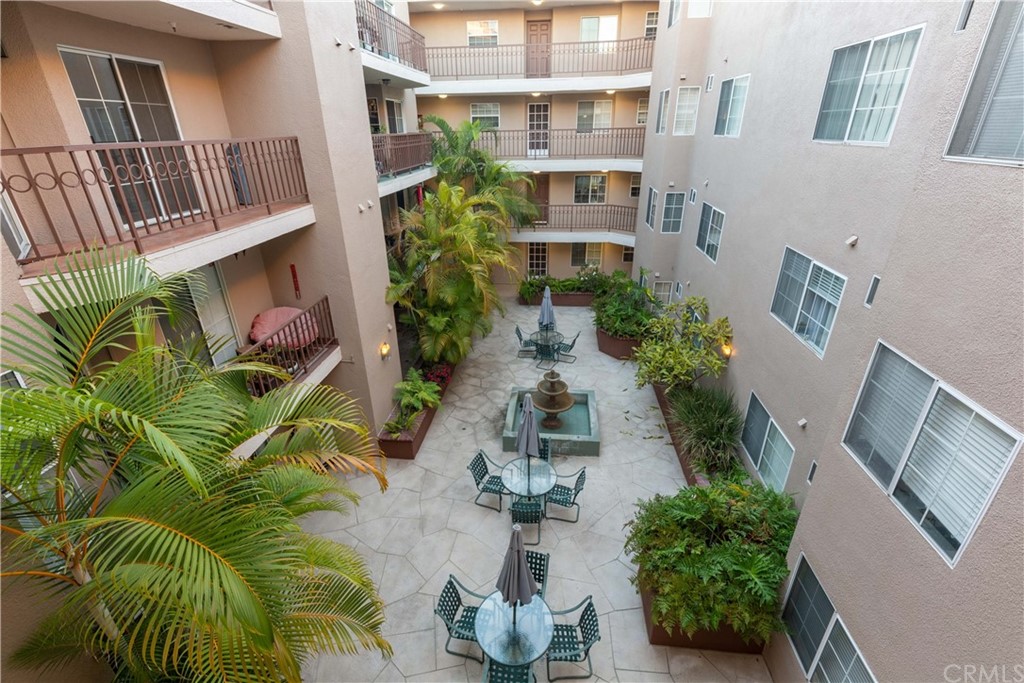 801 Pine Avenue, Unit 301 Long Beach, CA 90813 - Photo 17 of 18 a view of backyard of house along with deck and outdoor seating
