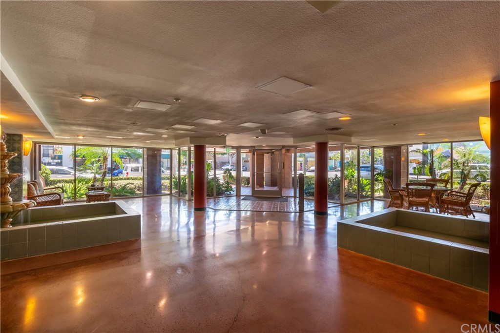 801 Pine Avenue, Unit 301 Long Beach, CA 90813 - Photo 4 of 18 a lobby with furniture and floor to ceiling window