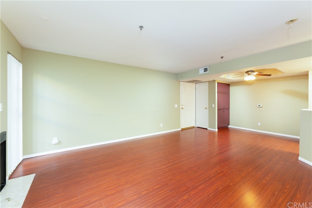801 Pine Avenue, Unit 301 Long Beach, CA 90813 - Photo 9 of 18 a view of an empty room with wooden floor