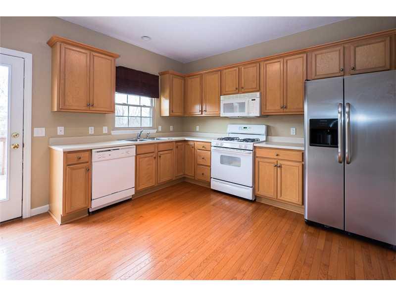 2426-unit E Rochester Road Franklin Park, PA 15143 - Photo 10 of 24 Kitchen. The large eat in kitchen has maple cabinetry and beautiful hardwood floors!