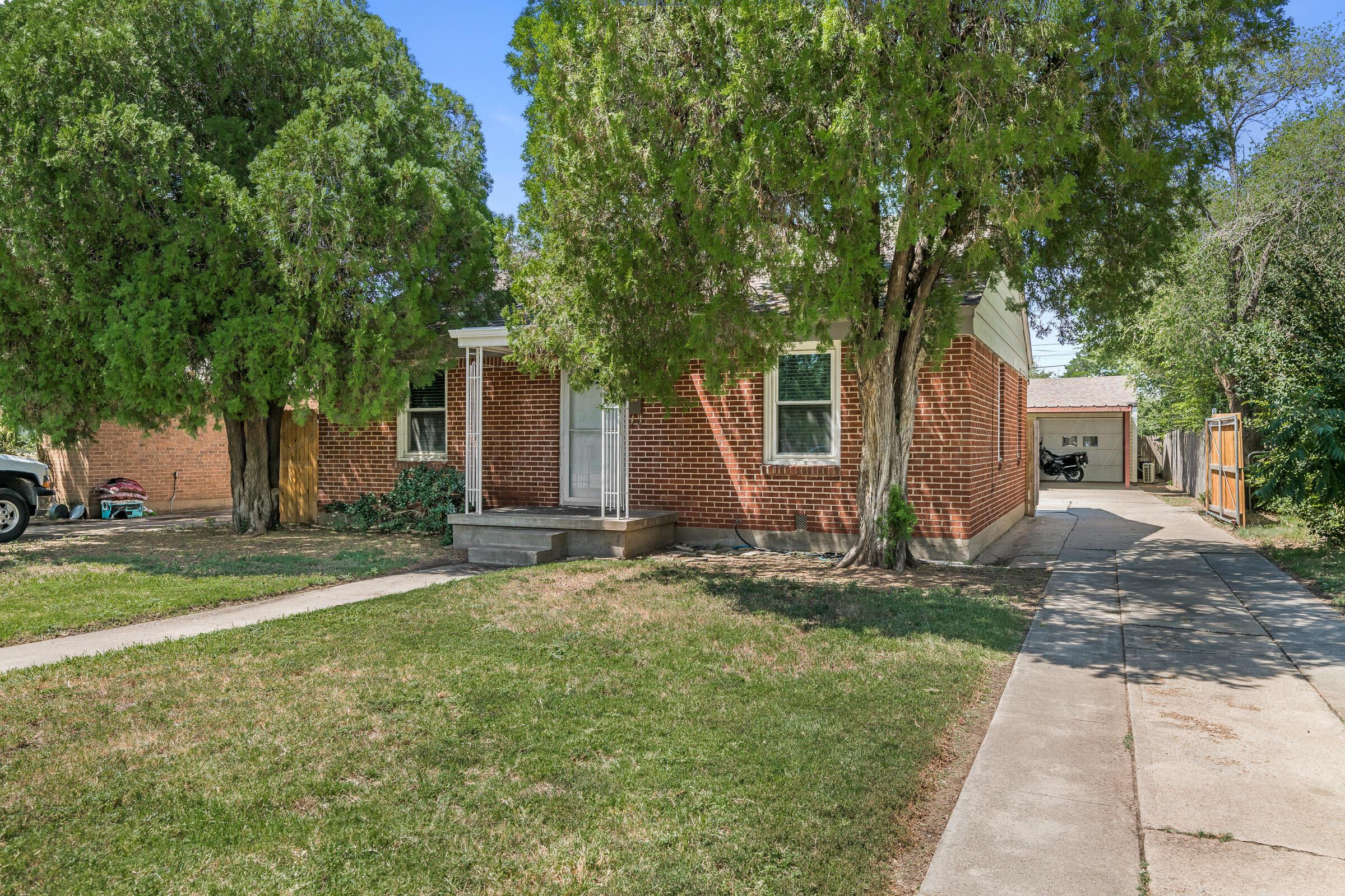 3620 South Hayden Street Amarillo, TX 79110 - Photo 5 of 25 a backyard of a house with yard and trampoline