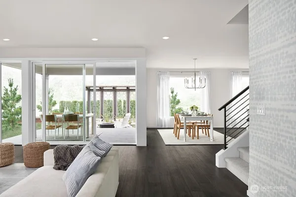 a living room with furniture fireplace and window