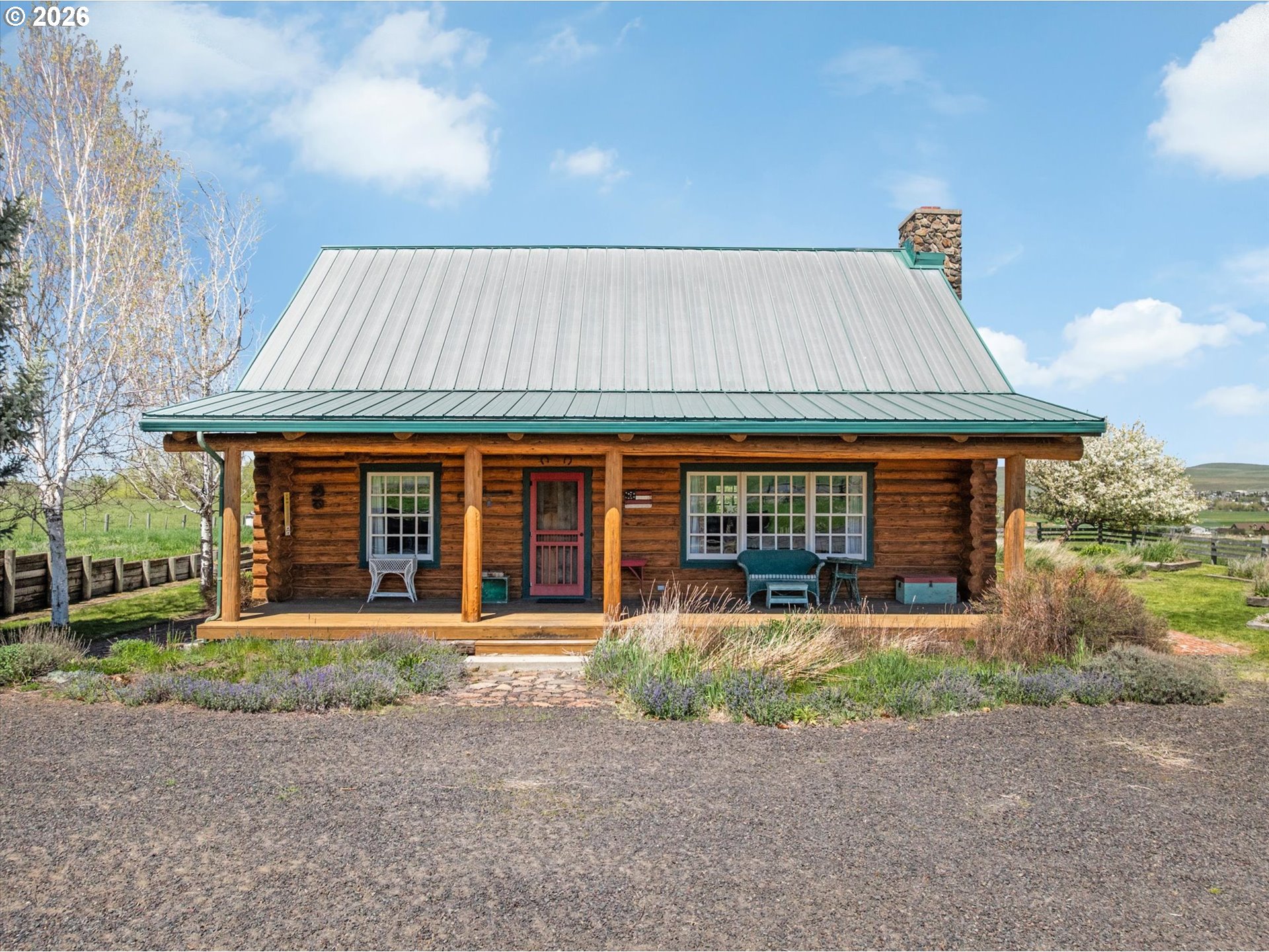 64782 Alder Slope Road Enterprise, OR 97828 - Photo 4 of 48 a front view of a house with garden